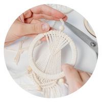 hands making macrame